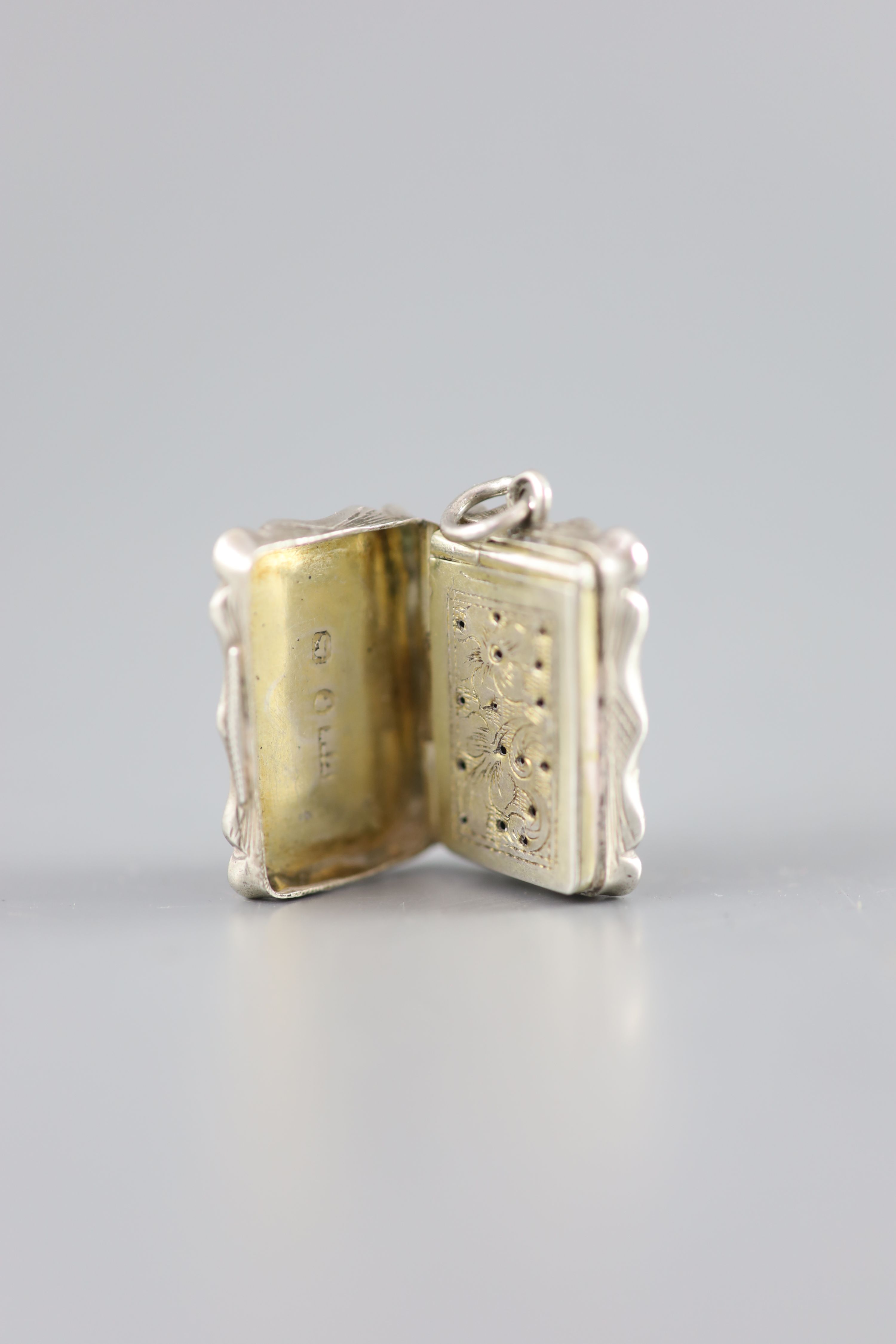 A Victorian silver rectangular vinaigrette, with engine turned ornament and ring, Frederick Marsden, Birmingham, 1860,